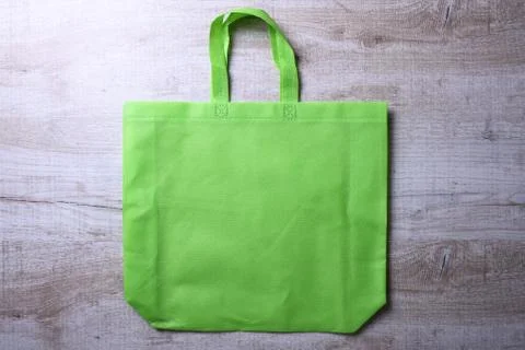 Textile bag on wooden background Stock Photos