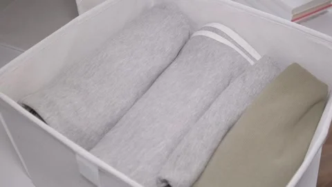 Textile case and organizer with folded clothes. The concept of order and storage Video stock 241024056