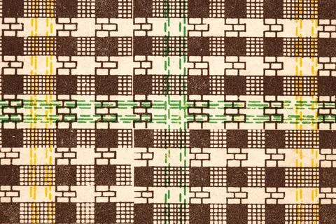 This textile displays a vibrant geometric pattern with bold colors like yellow Stock Photos