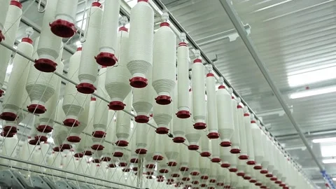 In a textile factory, machines make threads from cotton fiber. Vídeos de archivo 136221877