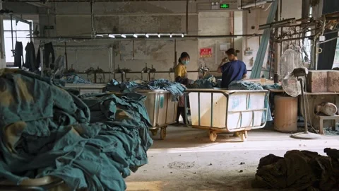 Textile Factory Storage Area Filled with Heavy Denim Cloth Material Rolls Vidéo 337087053