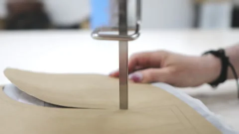 Textile factory worker cuts several layers of fabric. Stock Footage 280453063