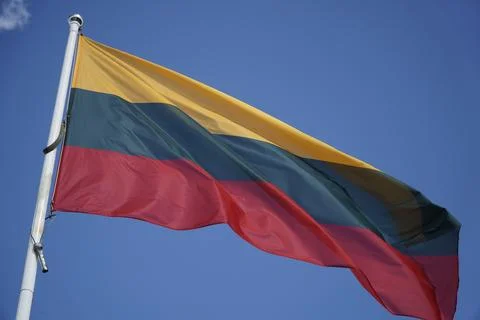 Textile flag of Lithuania and blue sky Stock-Fotos