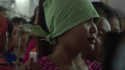 Textile Garment Factory Workers: CU garment workers waiting while others pass Stock Footage