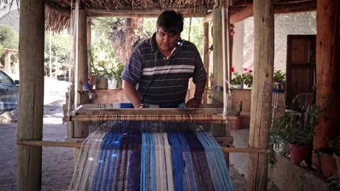 Textile hispanic weaver craftsman making products on a wooden handicraft loom Stock Footage 201880891