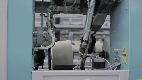 Textile industry. The automatic process of replacing a complete coil with Vídeos de archivo 263019614
