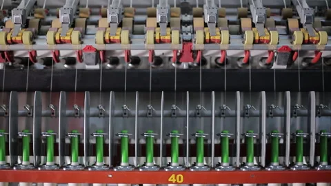 Textile industry. Machines wind the thread onto spools for spinning production Video stock 263015304