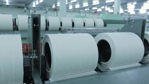 Textile industry. A spool with a rotating buckle for thread production. Textile Vídeos de archivo 263018192