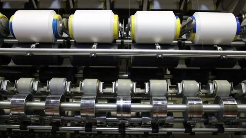 Textile Industry - Yarn Spools on a spinning machine Stock Footage 76300407