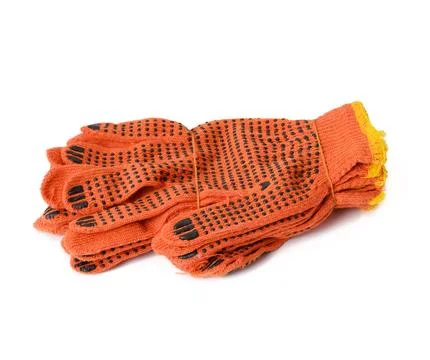 Textile orange work gloves on a white background. Protective clothing for m.. Stock Photos