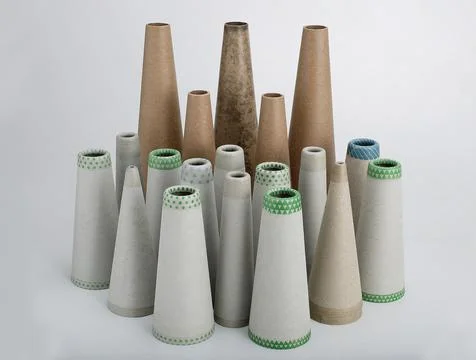 Textile paper cones group in different sizes on light grey background Stock Photos