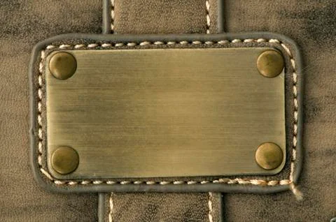 Textile patch sewn on fabric Stock Photos