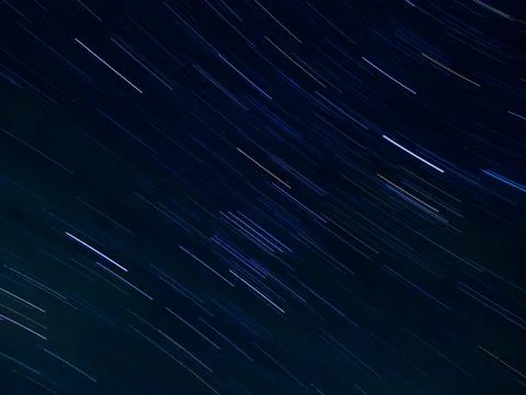 Textile pattern of star trails in the night sky Stock Photos