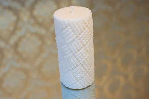 Textile pattern white soy wax candle Stock Photos