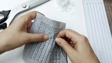Textile stitching process close up handmade craft footage Video stock 330050584