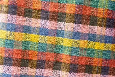 Textile surface with colored patterns Stock Photos
