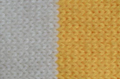 Textile texture of wool is yellow and white in color. Stock Photos
