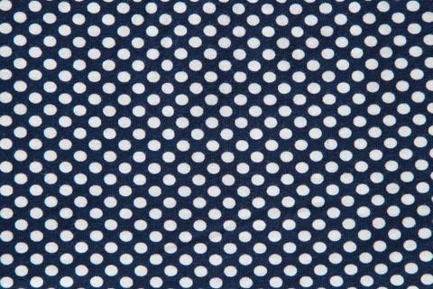 Textile white cirlces on dark background Foto stock