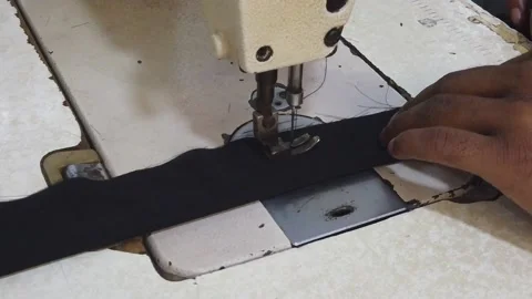 Textile worker sewing cloth in developing country Stock Footage 179430518