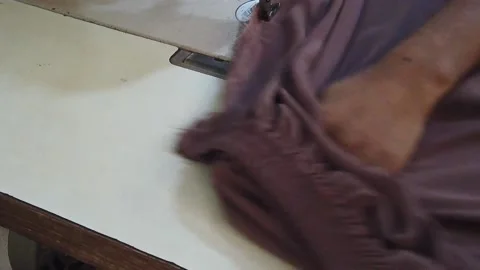 Textile worker sewing cloth in developing country Stock Footage 179430650