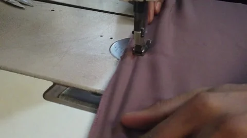 Textile worker sewing cloth in developing country Stock Footage 179430651