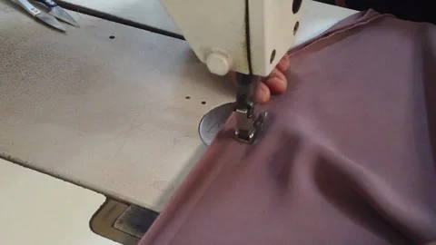 Textile worker sewing cloth in developing country Stock Footage 179431167