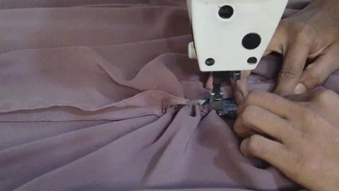 Textile worker sewing cloth in developing country Stock Footage 179432787