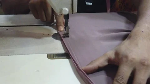 Textile worker sewing cloth in developing country Stock Footage 179432788