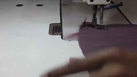 Textile worker sewing cloth in developing country Stock Footage 179432802