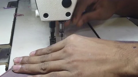 Textile worker sewing cloth in developing country Stock Footage 179432886