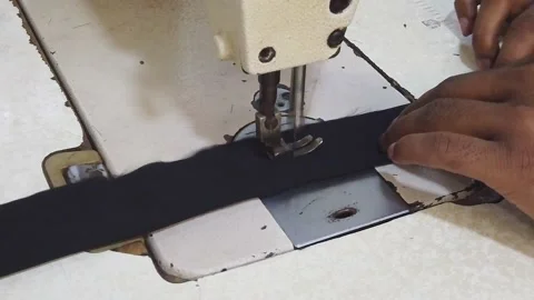 Textile worker sewing cloth in developing country Stock Footage 179432977