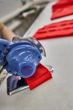 Textile Worker Using Rotary Cutter to Cut Fabric Stock Photos