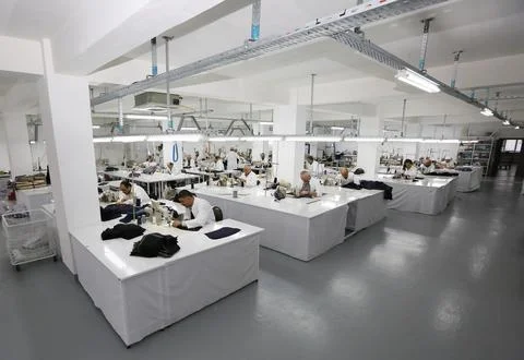 Textile workers work in a textile factory Stock Photos