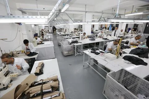 Textile workers work in a textile factory Stock Photos