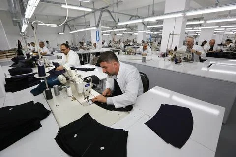 Textile workers work in a textile factory Stock Photos