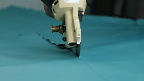 Textile Workshop. Tailoring. Cut Material. Rotating Hand Saw. Fabric Section Stock Footage 146107085