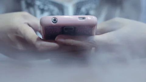 Texting and browsing smartphone for emergency contact, smoke spreading Stock Footage 61193191