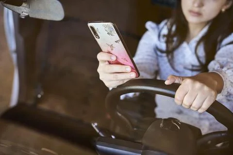 Texting and driving concept Stock Photos