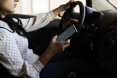 Texting and driving concept Stock Photos