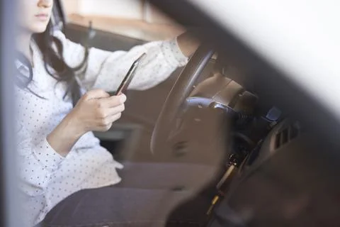 Texting and driving concept Stock Photos