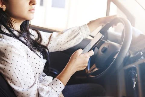 Texting and driving concept Stock Photos