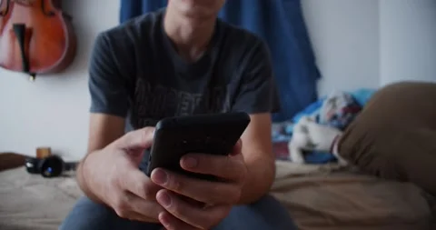 Texting on Bed Stock Footage 141553216