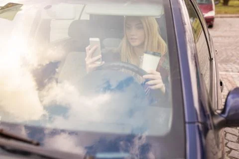 Texting in the car Stock Photos