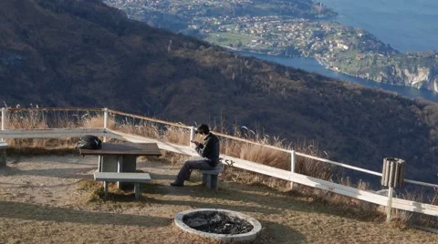 Texting on a cell phone instead of watching the wonderful view Stock Footage 59534363