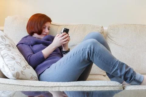 Texting on cell phone Stock Photos