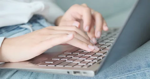 Texting on laptop keyboard close up, close up side view, person typing on Video stock 158381838