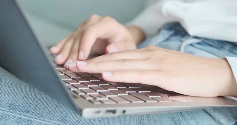 Texting on laptop keyboard close up side view, person typing on keyboard working Video stock 156485146