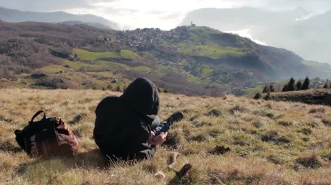 Texting in the mountains with your mobile Stock Footage 46227800