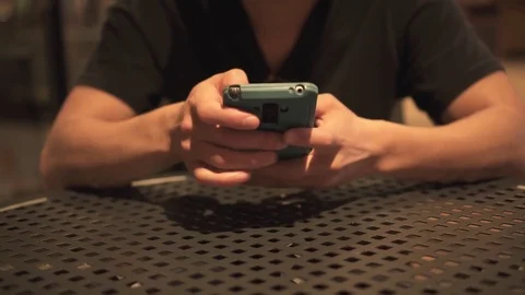 Texting on the phone at the coffee shop Stock Footage 80732922
