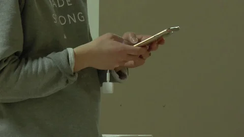 Texting on Phone with Cube 스톡 동영상 99477860